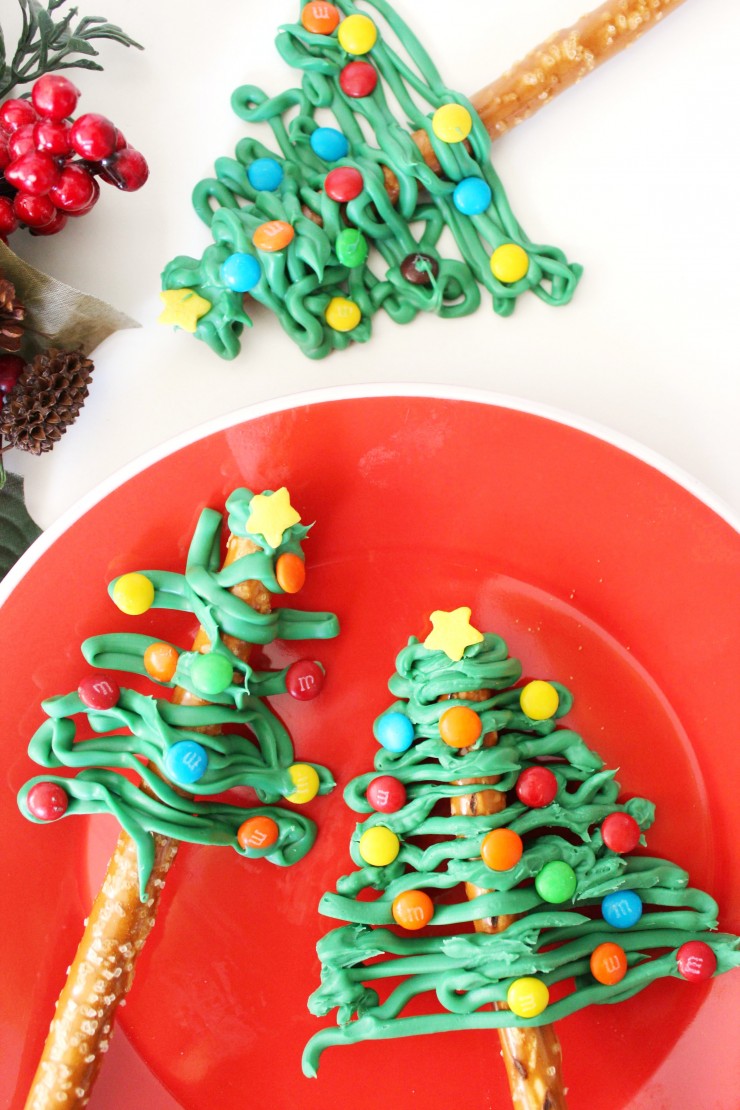 These Pretzel Christmas Trees make a simple and easy to make treat that look far more complicated than they really are. This of course makes them the perfect treat to impress your holiday party guests with!