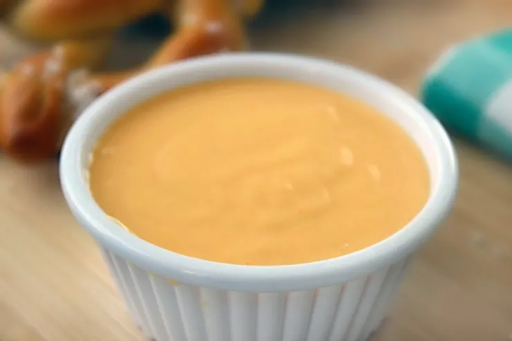 This is a Classic Cheese Dipping Sauce Recipe perfect for pairing with pretzels or nachos as an appetizer and works great over veggies like brocolli too!