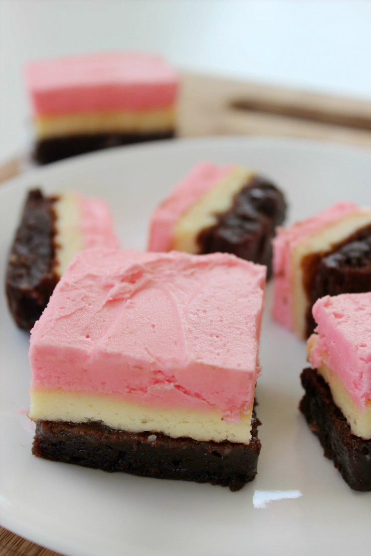 These Neapolitan Brownie Cheesecake Bars are a pretty and delicious dessert recipe!