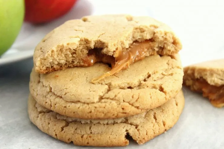 These Caramel Apple Cider Cookies feature an apple cider spiced cookie stuffed with ooey gooey caramel!