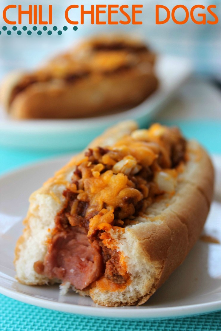 Chili Cheese Dogs are an American Classic - Hotdogs Smothered in Chili Con Carne, Cheddar Cheese and Onion.