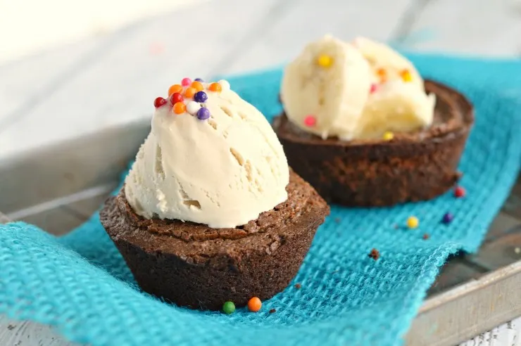 These Mini Brownie Bowls are super easy to make and are fun to fill with everything from fruit to ice cream. These are great for a tasty treat or a party dessert!