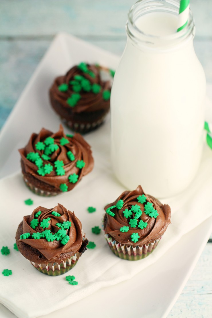 These Mini St. Patrick's Day Chocolate Mint Cupcakes are a great dessert to bring to any st patricks day parties. The tiny shamrocks make them just adorable!