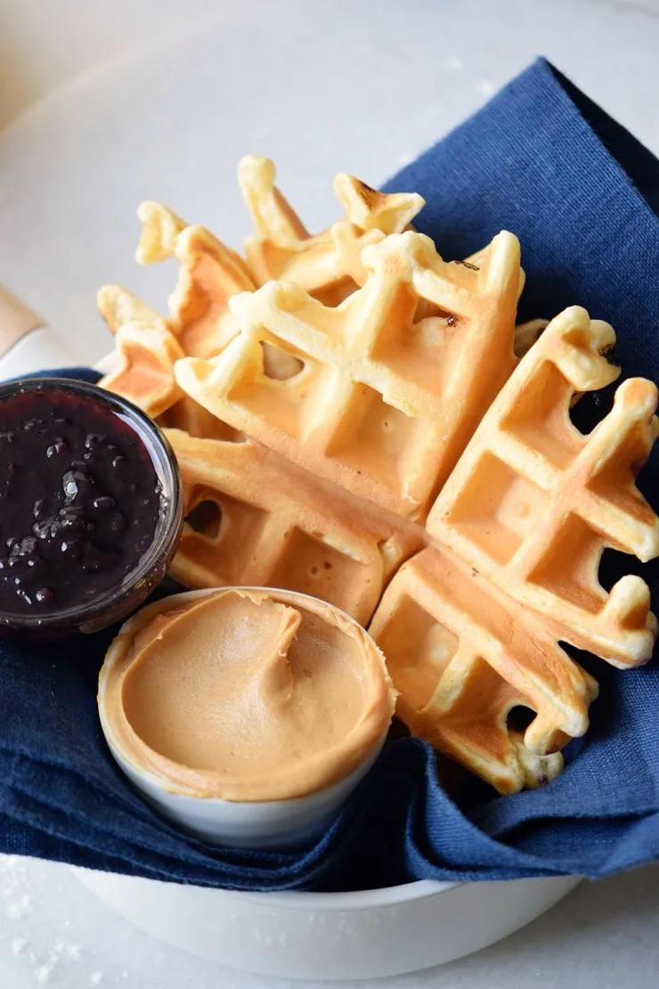 These golden, fluffy Peanut Butter and Jelly waffles are filled with creamy peanut butter and sweet jelly, mixed straight into the batter. 