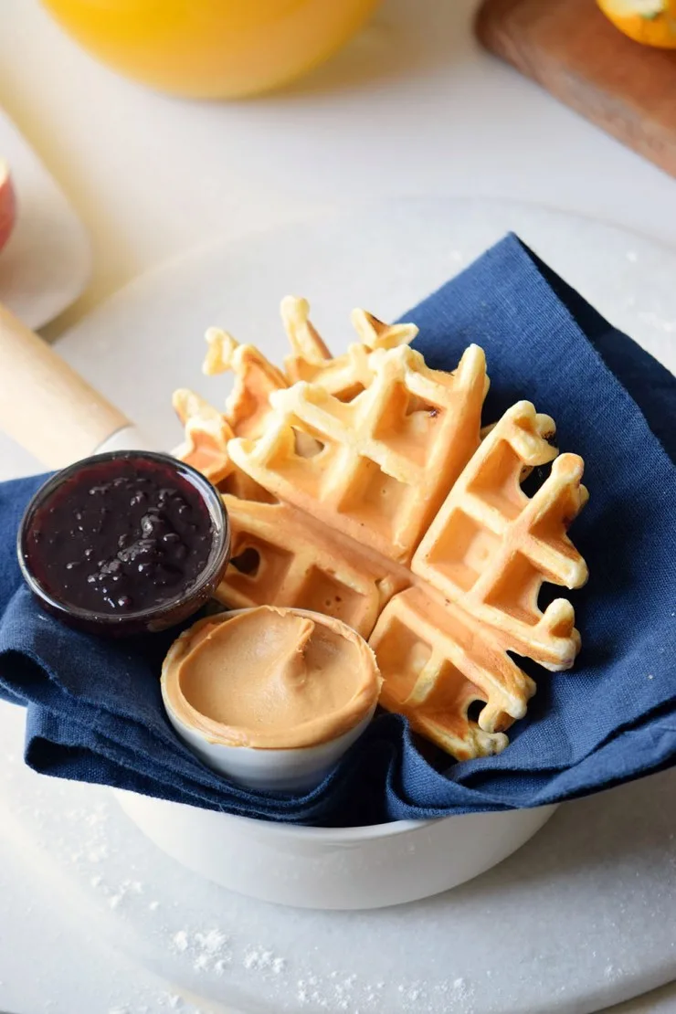 These golden, fluffy Peanut Butter and Jelly waffles are filled with creamy peanut butter and sweet jelly, mixed straight into the batter. 