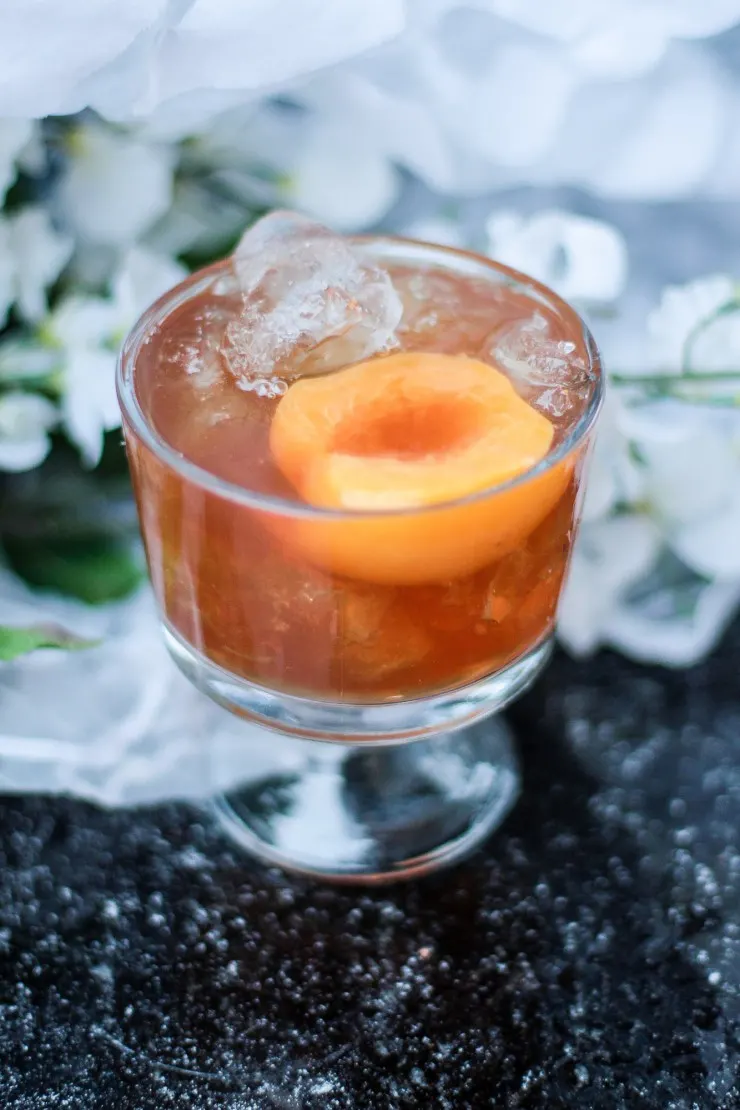 The Peach Praline Cocktail is a refreshing drink with a nutty-sweet flavour and a hint of spice. You could easily mistake it for dessert, it is that good!
