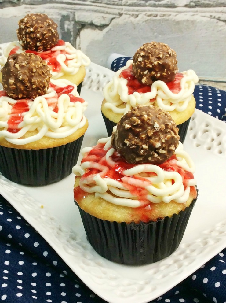 These Spaghetti & Meatballs Cupcakes are a fun treat that everyone is sure to love. How cute are these cupcakes? They look like real spaghetti and meatballs on top of a cupcake! Did it fool you?