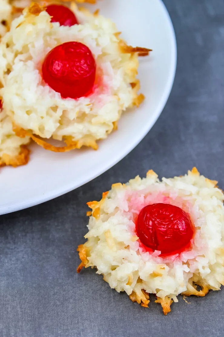 Cherry Macaroons are one of my all time favourite Christmas cookies. Classic coconut macaroons are topped off with a cherry for real old-world charm.