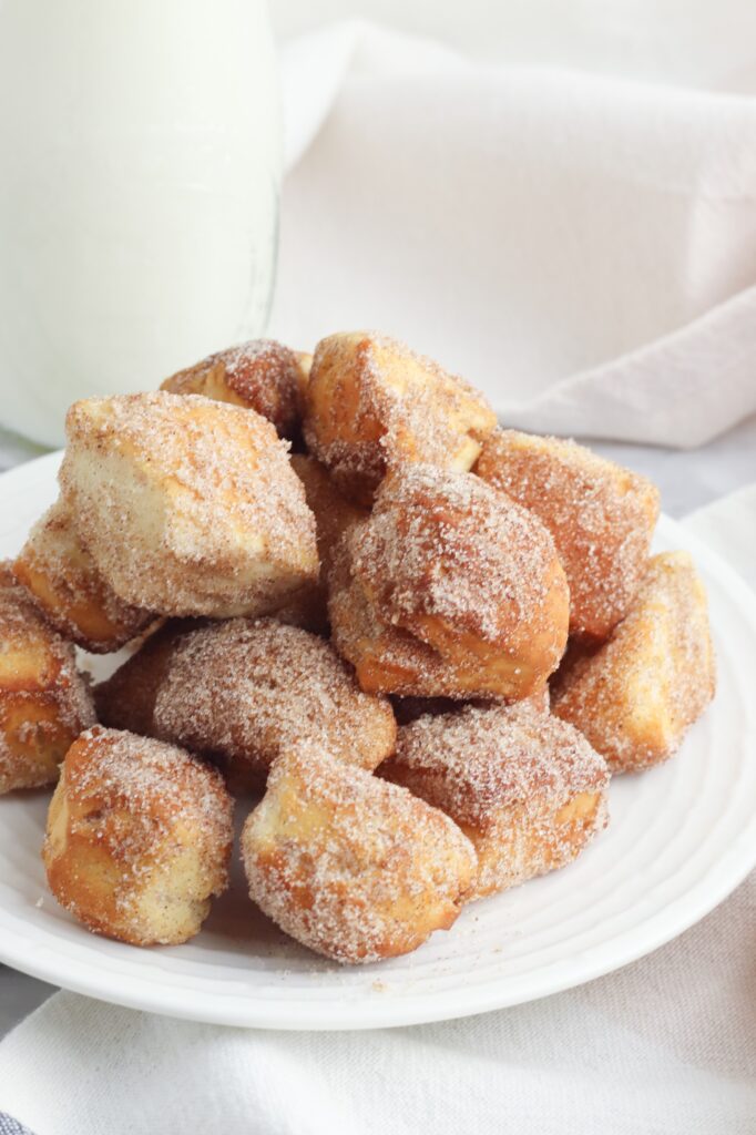 This Air Fryer Donut Bites recipe starts with canned biscuit dough for the easiest air fryer dessert you can make.