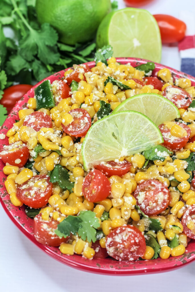 This Mexican Street Corn Salad, also known as Esquites, is fresh, lightly creamy, spicy, & incredibly delicious.
