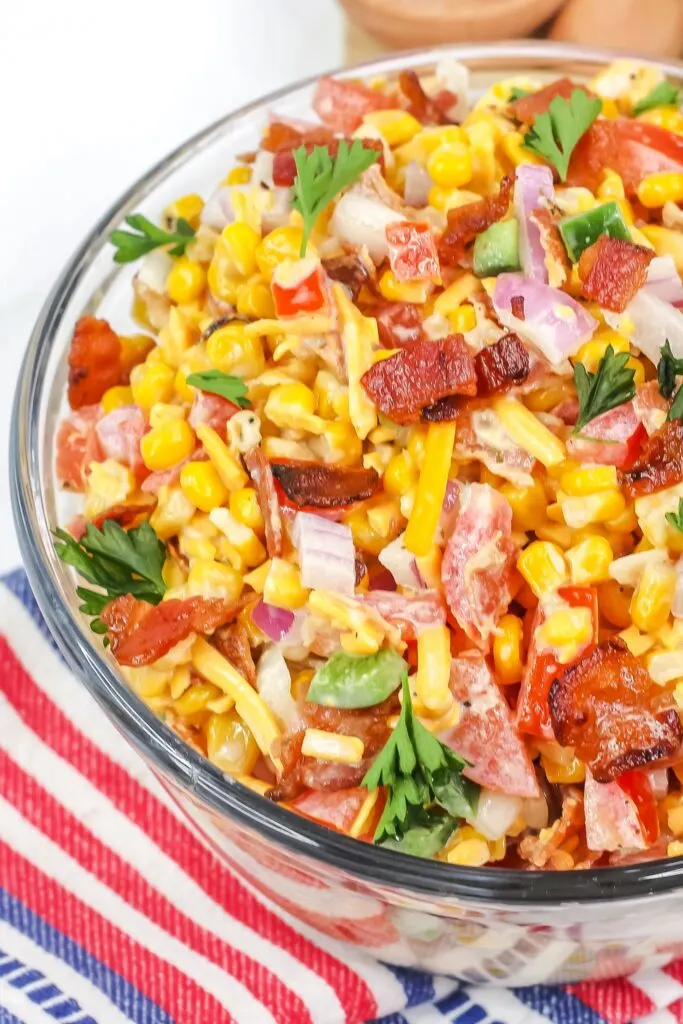 Sweet & Salty, Crunchy & Creamy; this Grilled Crack Corn Salad Recipe makes an addictive summer side dish featuring roasted corn and bacon.