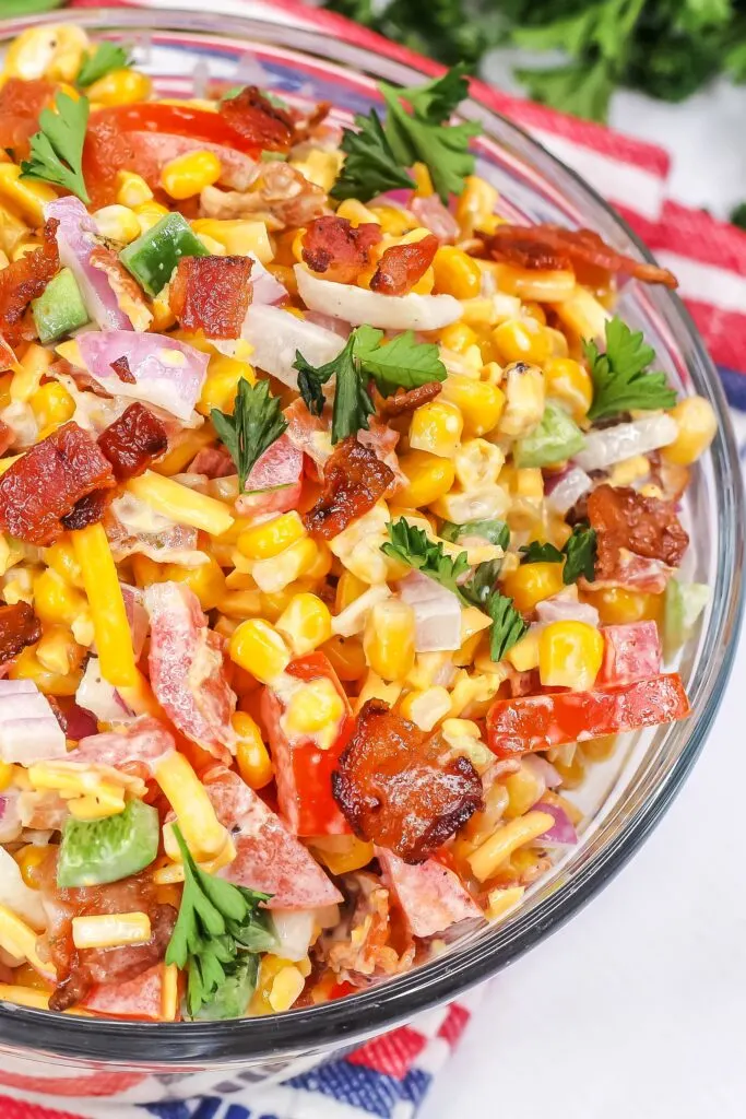 Sweet & Salty, Crunchy & Creamy; this Grilled Crack Corn Salad Recipe makes an addictive summer side dish featuring roasted corn and bacon.