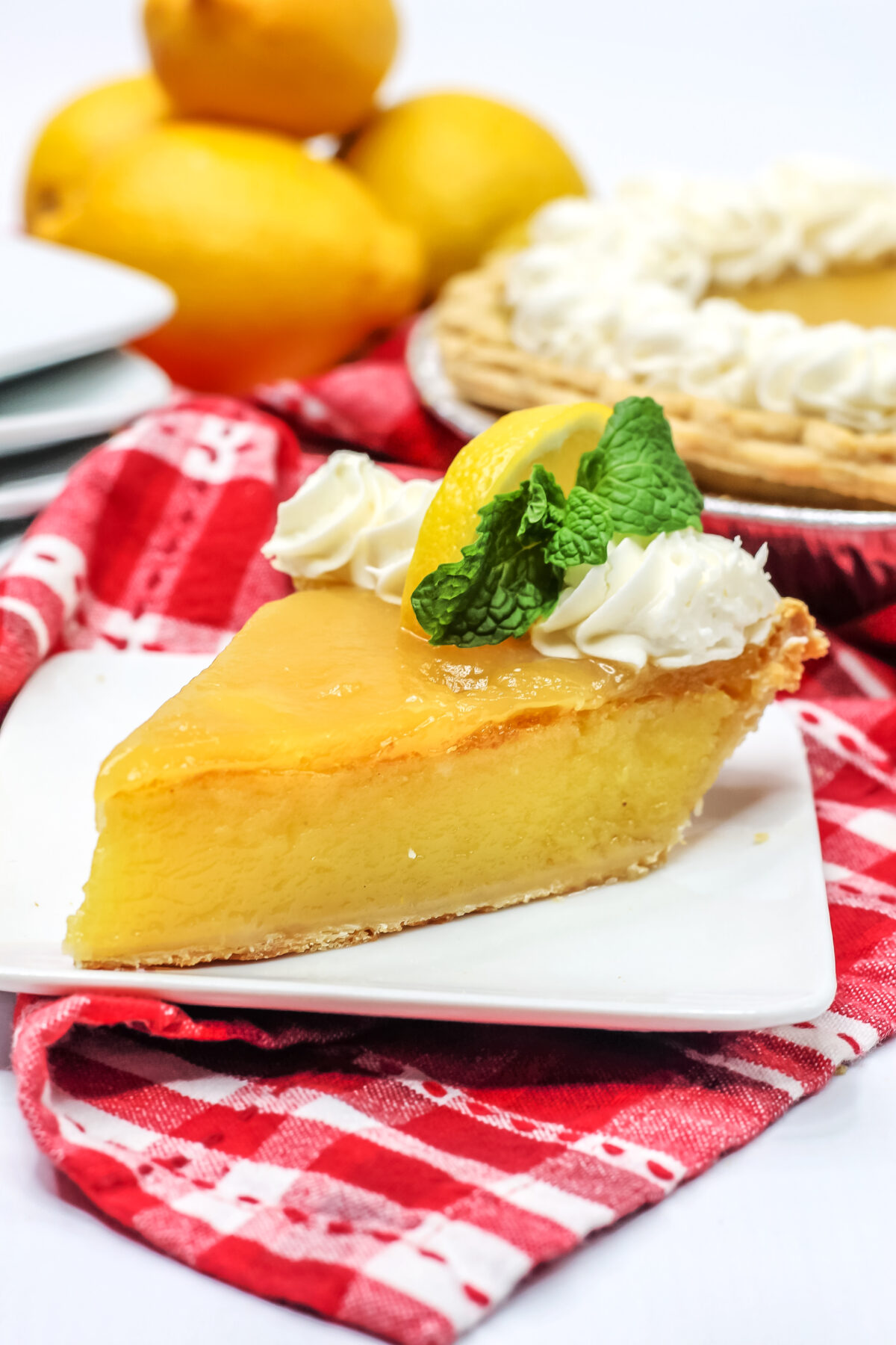 Smooth, custardy, tangy and sweet, this Lemon Chess Pie is made with the classic recipe then topped with lemon curd for the best Chess Pie!