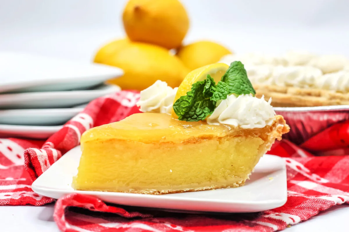 Smooth, custardy, tangy and sweet, this Lemon Chess Pie is made with the classic recipe then topped with lemon curd for the best Chess Pie!