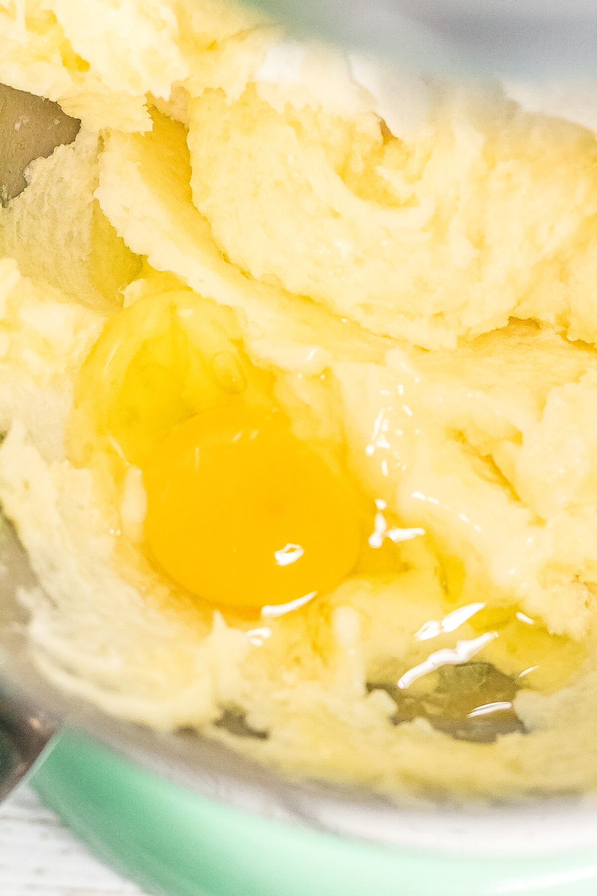 Mixing Eggs into the butter and sugar.