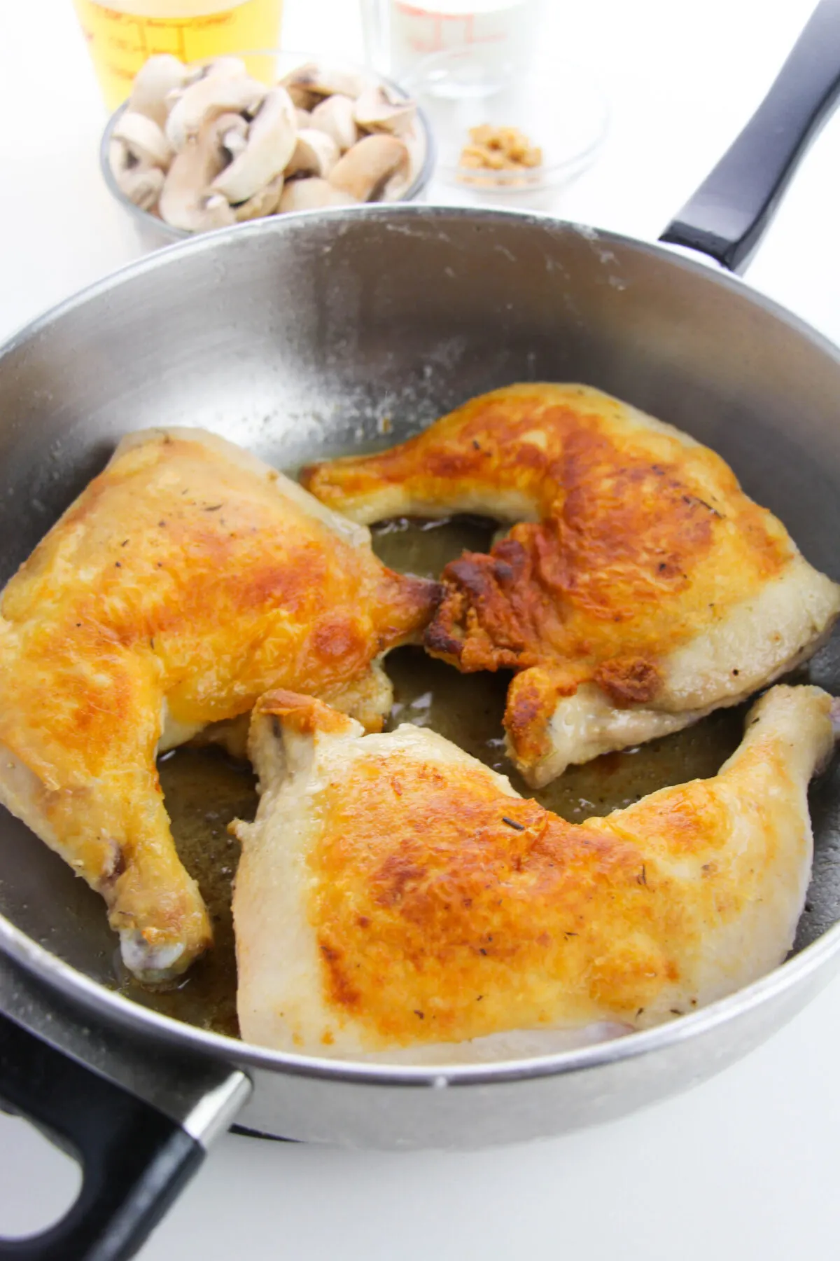chicken browning in a skillet/