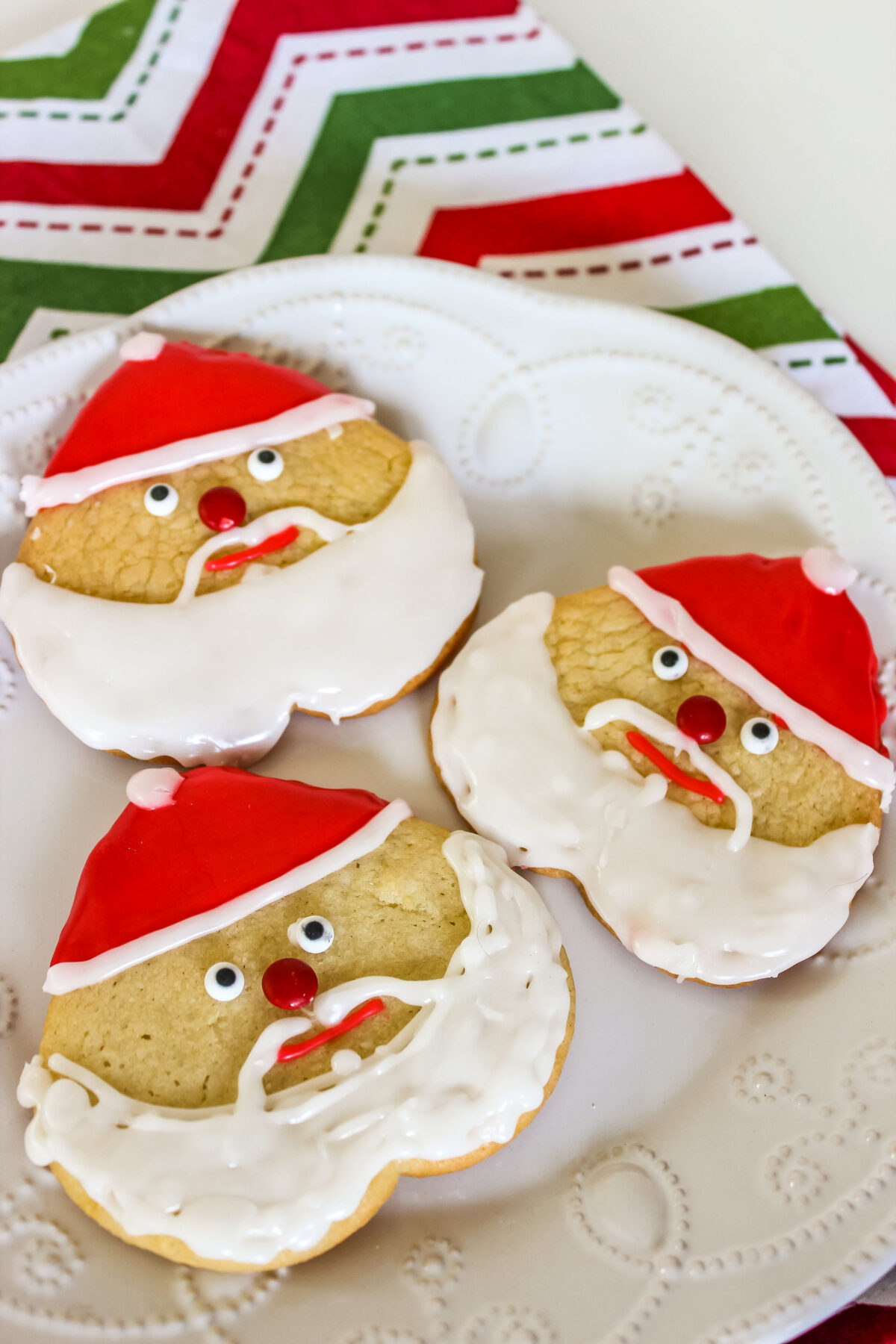 These Santa Sugar Cookies are deceptively easy to put together and look fabulous on your Christmas Cookie Plate!