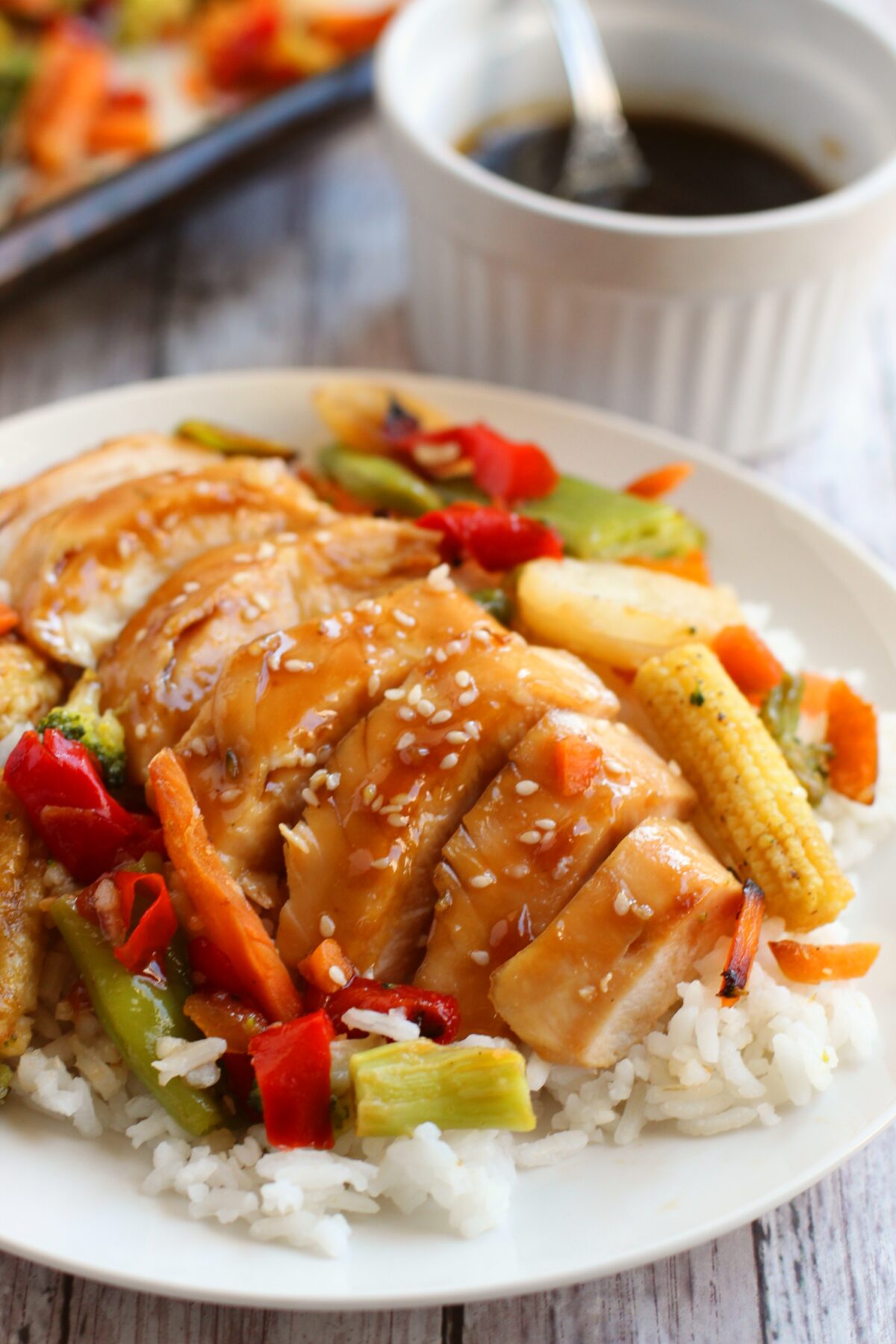 The best baked sheet pan chicken teriyaki recipe for busy weeknights! Full of juicy and tender chicken on a bed of sweet and tangy veggies!