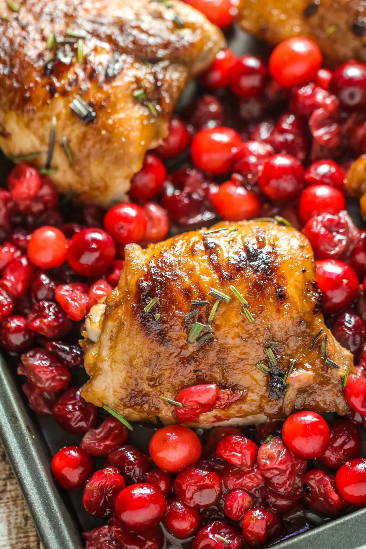 Forget about a boring night of the usual. Make your dinner more festive with this easy recipe for sheet pan cranberry roasted chicken!