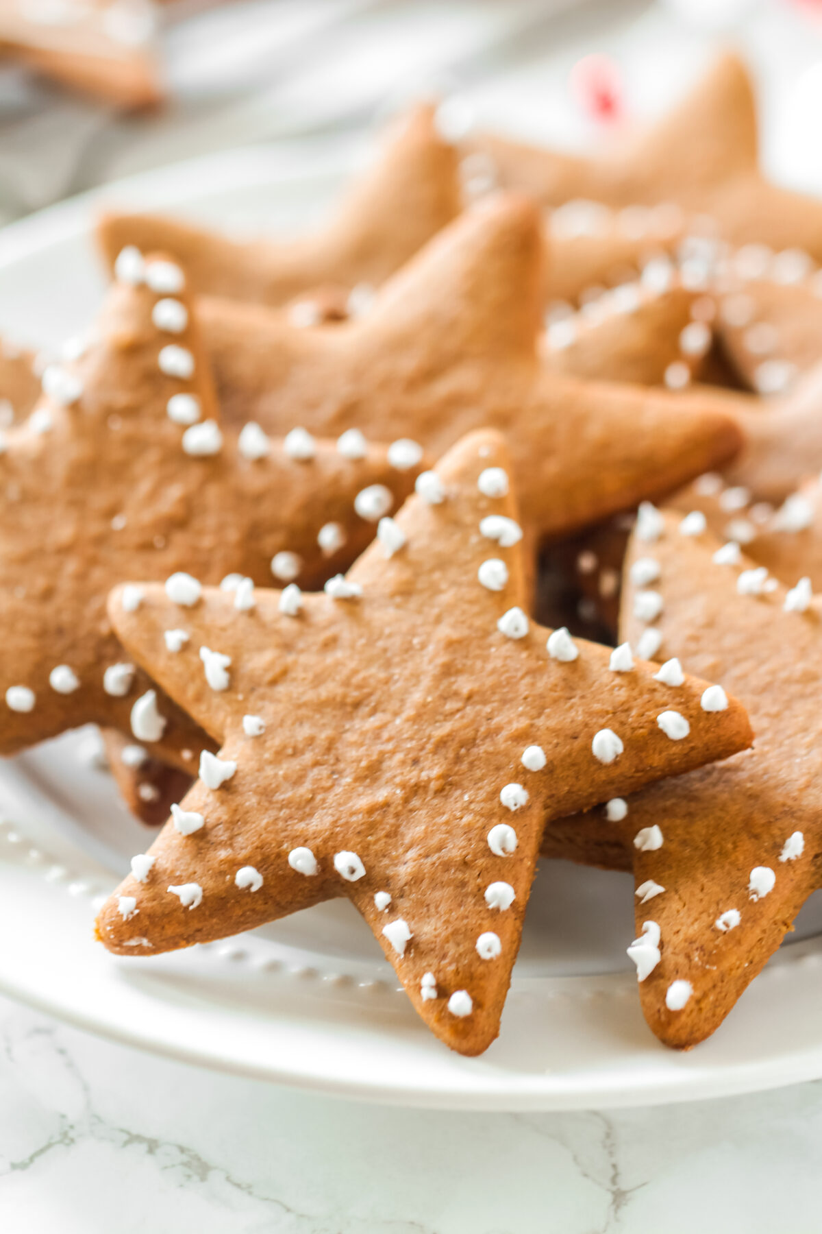 This Christmas gingerbread star cookies recipe is so easy to make and it's the perfect treat for your holiday cookie platter.