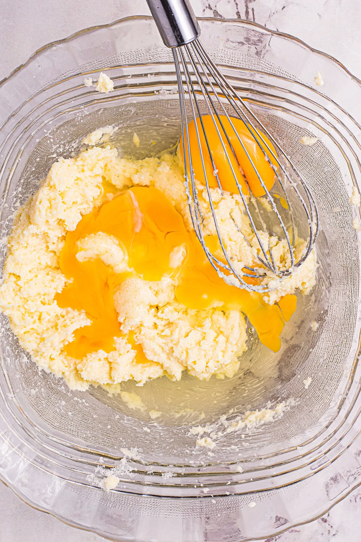 Eggs being mixed into the butter and sugar.