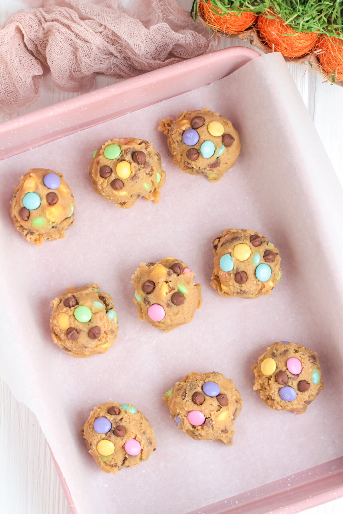 spoonfuls of Easter chocolate chip dough in a pan ready to chill in the fridge.