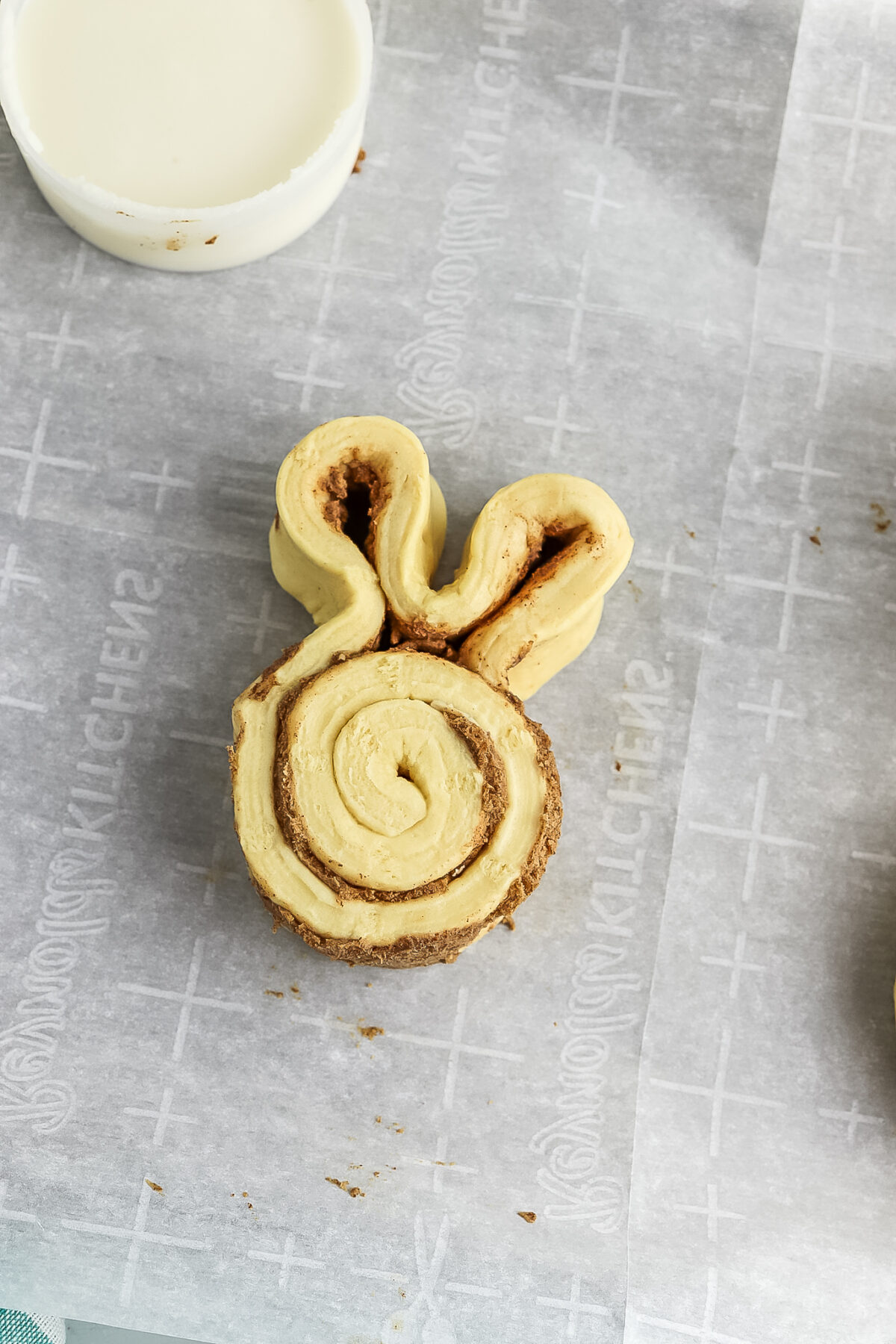 shaping the cinnamon roll bunnies with ears.