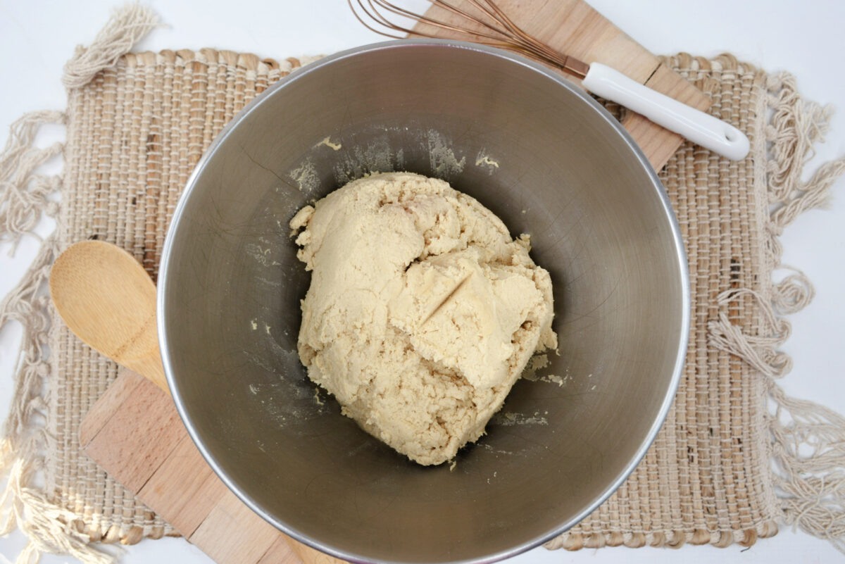 The dough prepared in a large mixing bowl.