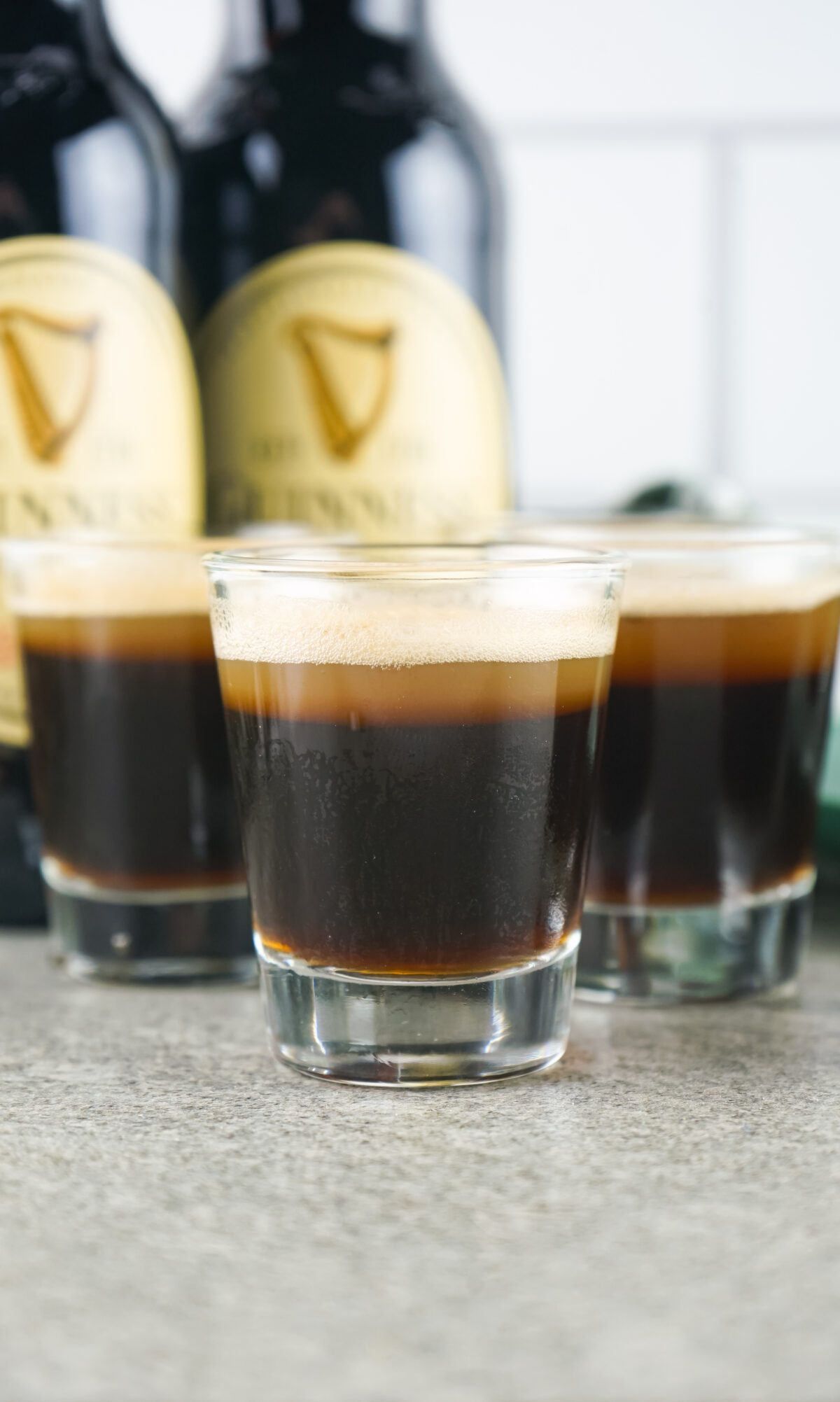 Guinness Jell-O shots are perfect for your next party! Made with stout, Kahlua, and vodka, they look just like mini pint glasses of Guinness.