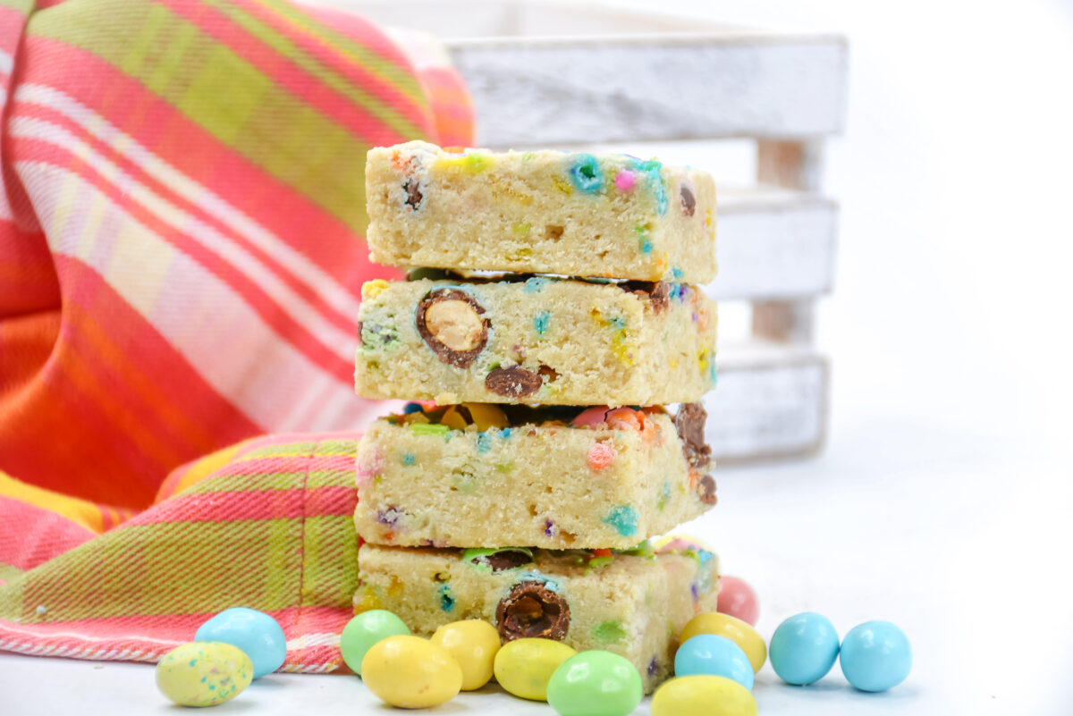 Make this delicious Easter M&M Cookie Bars recipe for a fun and easy spring dessert loaded with Easter m&ms and pastel sprinkles!