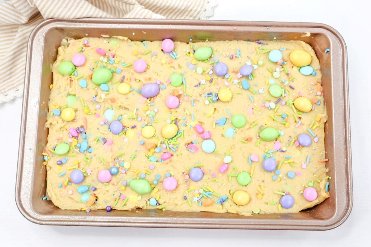Sprinkles and more m&ms over the dough,