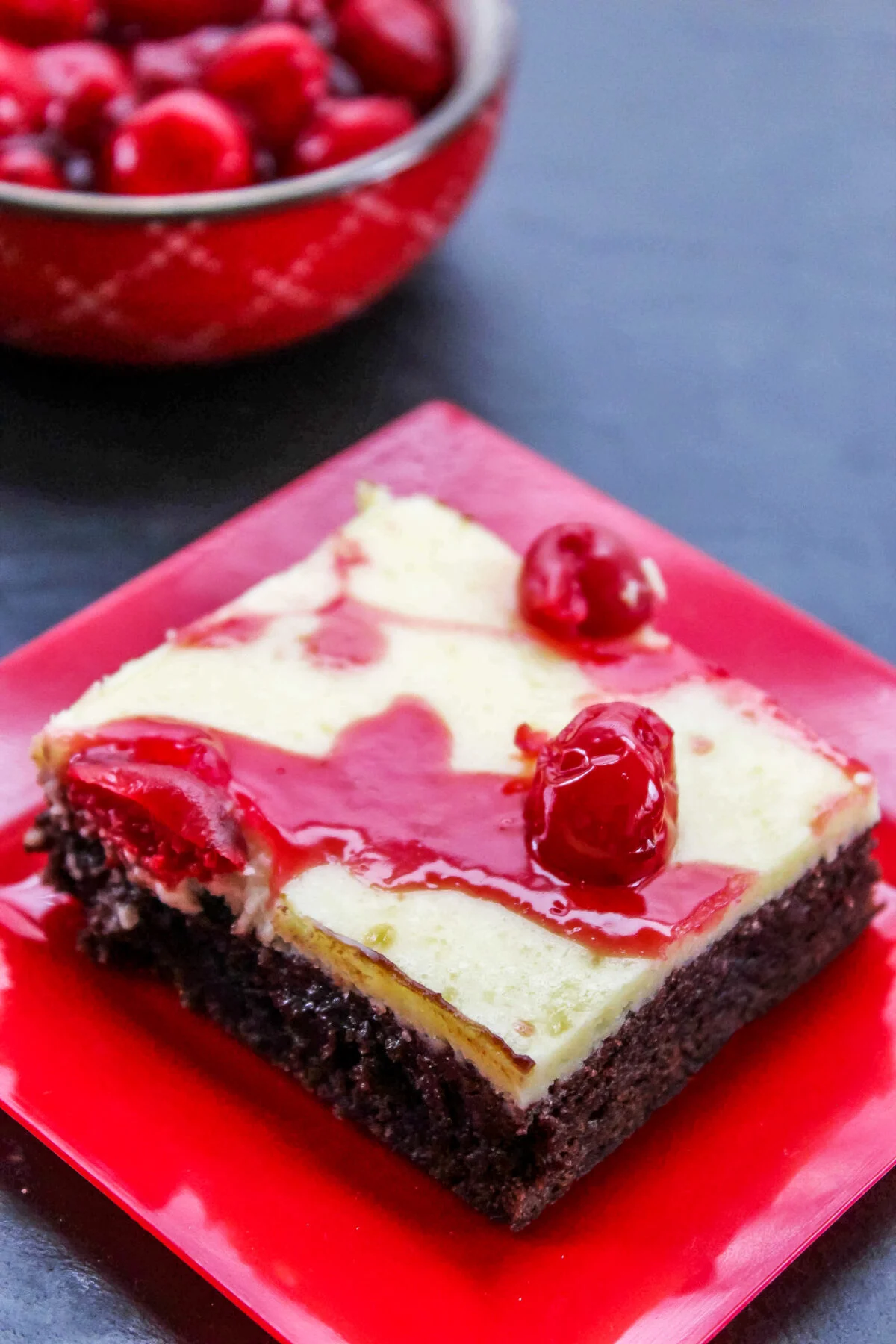 These Cherry Cheesecake Brownies are gooey, fudgy and perfectly sweet. The cheesecake center sends them over the top! Easy to make too.