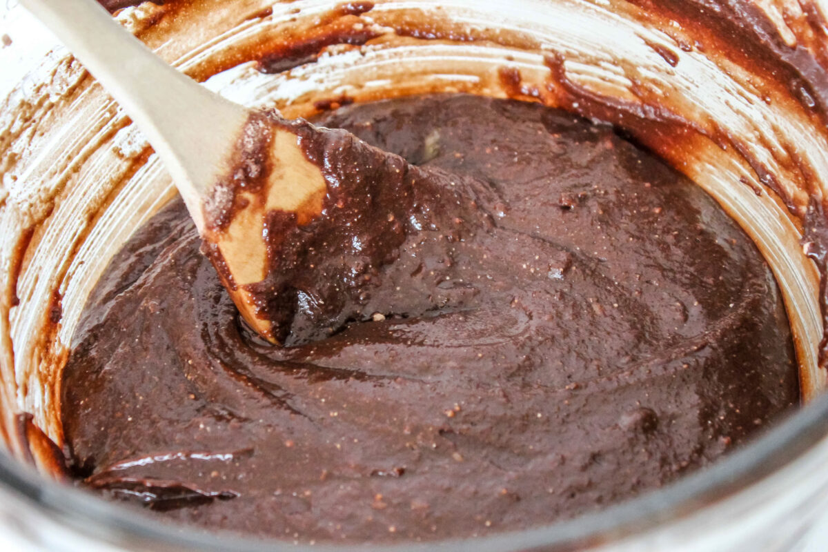 Making the brownie batter in a large bowl.