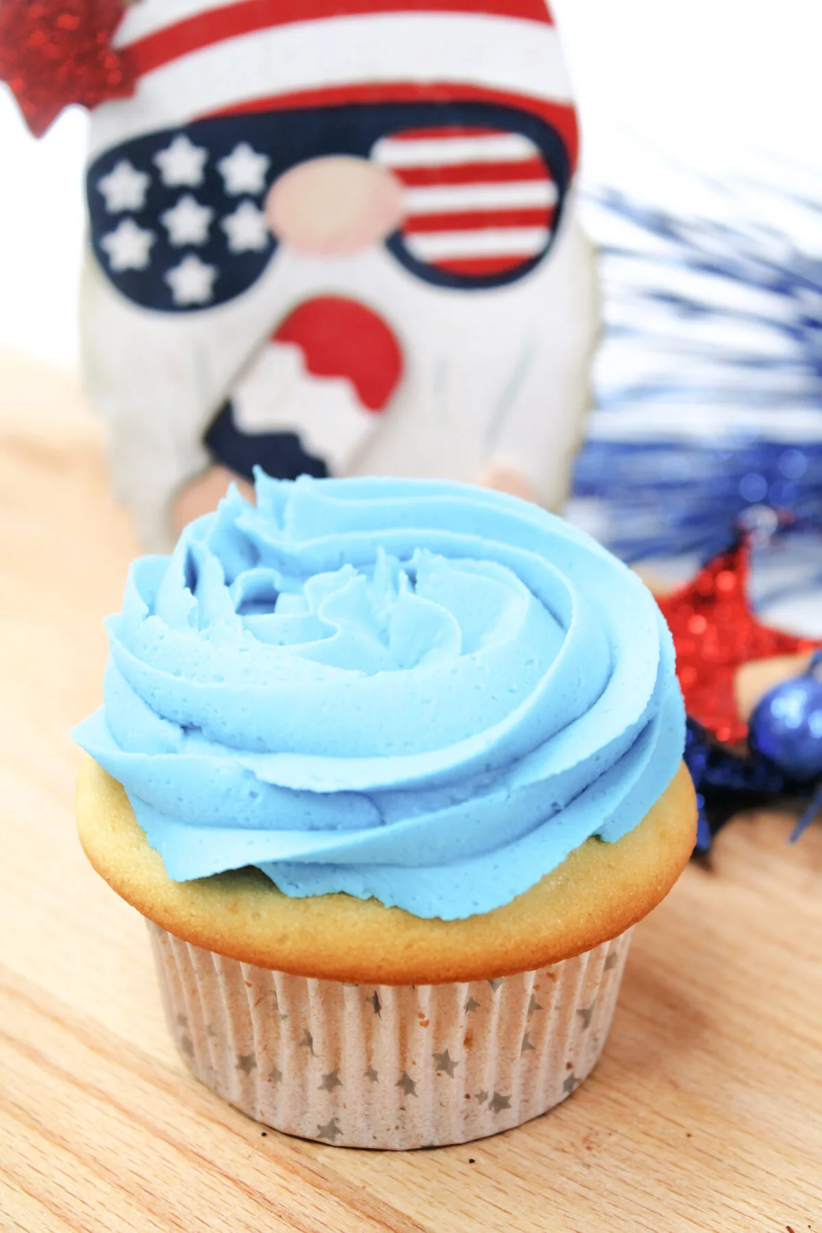 Blue frosting piped onto the top of a cupcake.