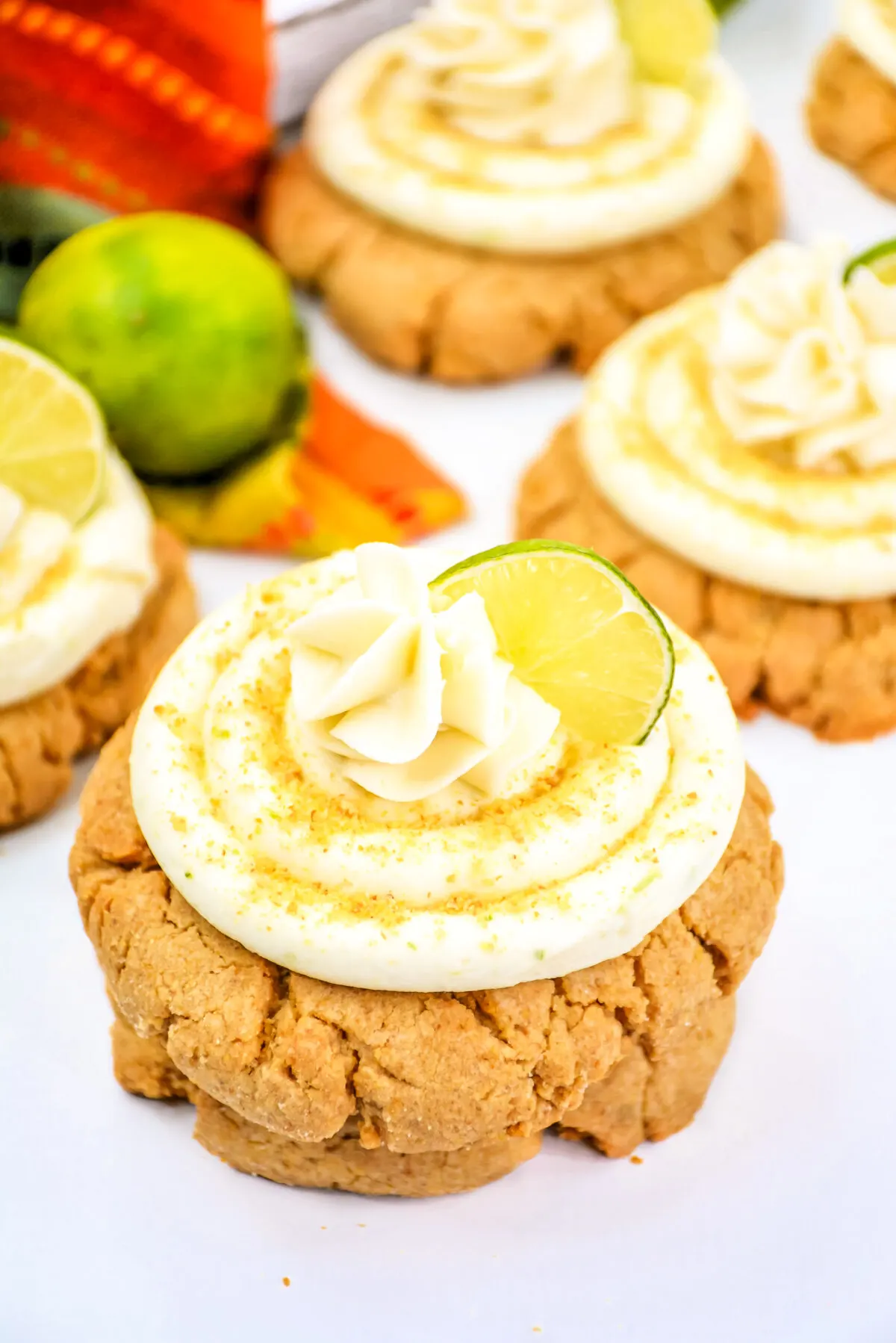 Love key lime pie? This Crumbl key lime cookie recipe is the perfect way to get your fix. Tart key lime frosting tops a tender graham cookie.