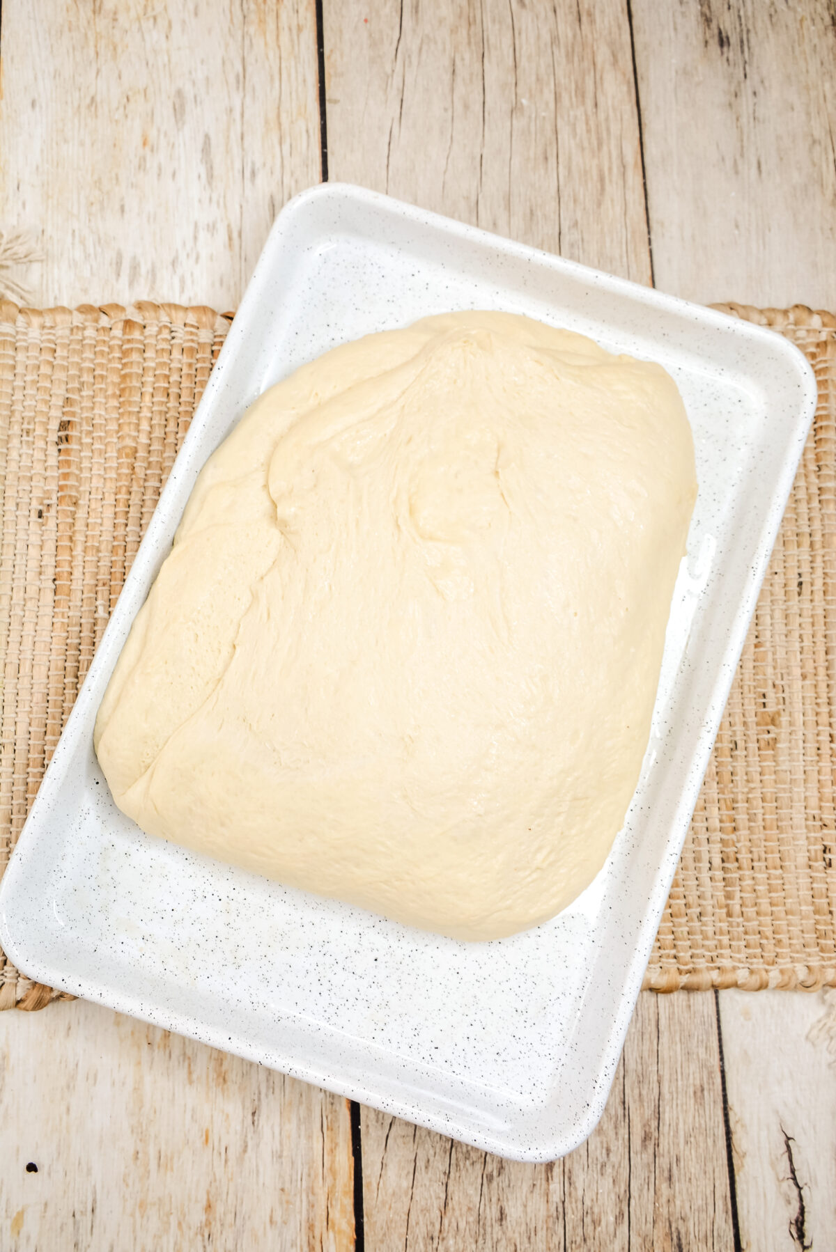 Press the dough out into the sheet pan forming a rectangle.