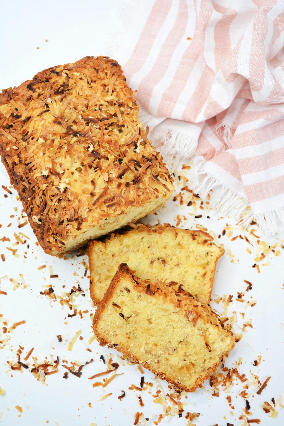 This delicious sweet pineapple coconut bread recipe is perfect for breakfast or dessert! It's loaded with toasted coconut and pineapple.