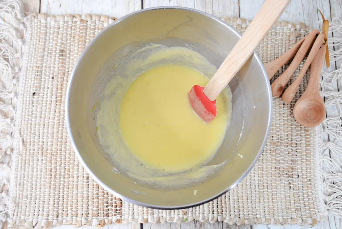 Using a large bowl, beat the butter and sugar until fluffy.