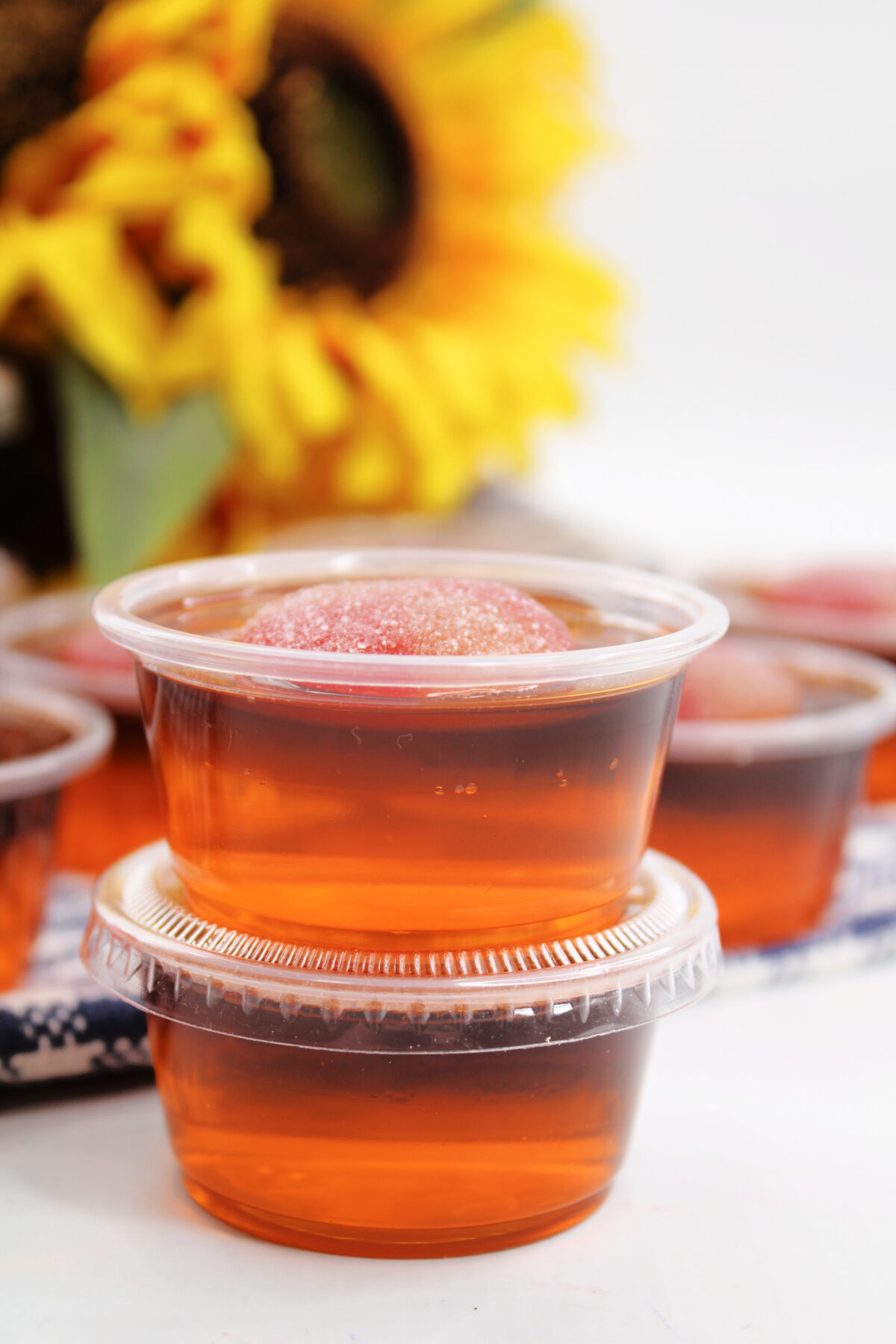 Looking for a fun and easy party recipe? These Crown Peach Jello Shots are perfect for your next get together!