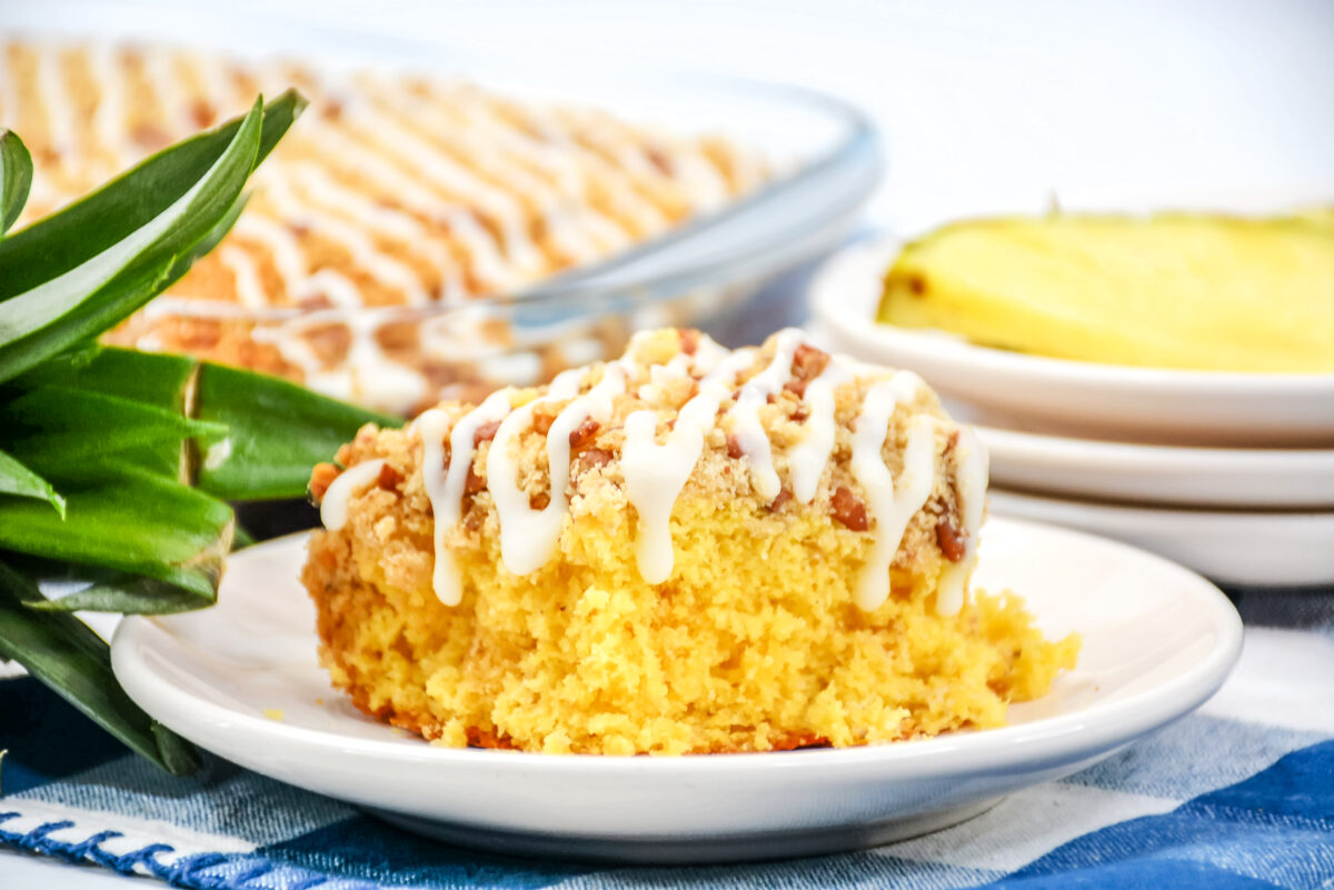 This scrumptious and easy pineapple sheet cake recipe is made with canned pineapple with a homemade crumb topping and pineapple icing.