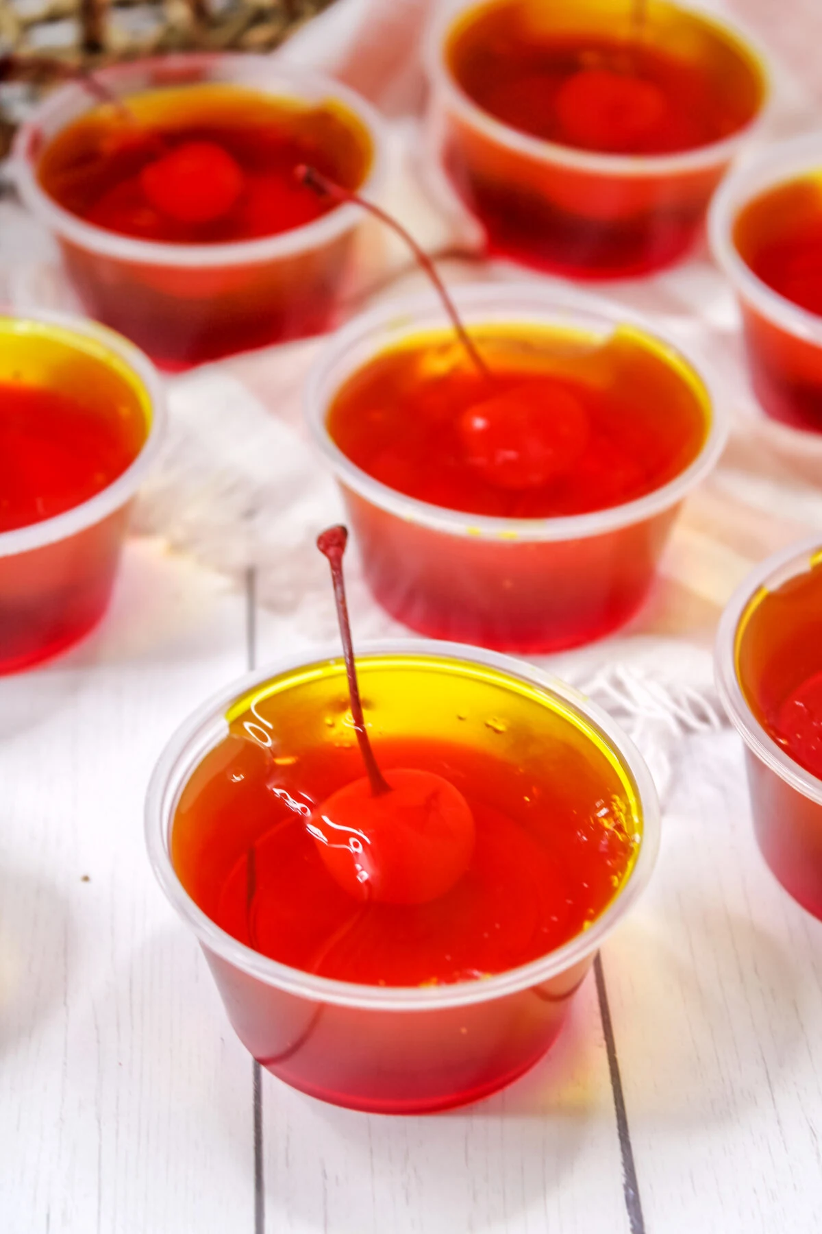 These pineapple upside down jello shots are a take on traditional pineapple upside down cakes. They're perfect for any party or get together!