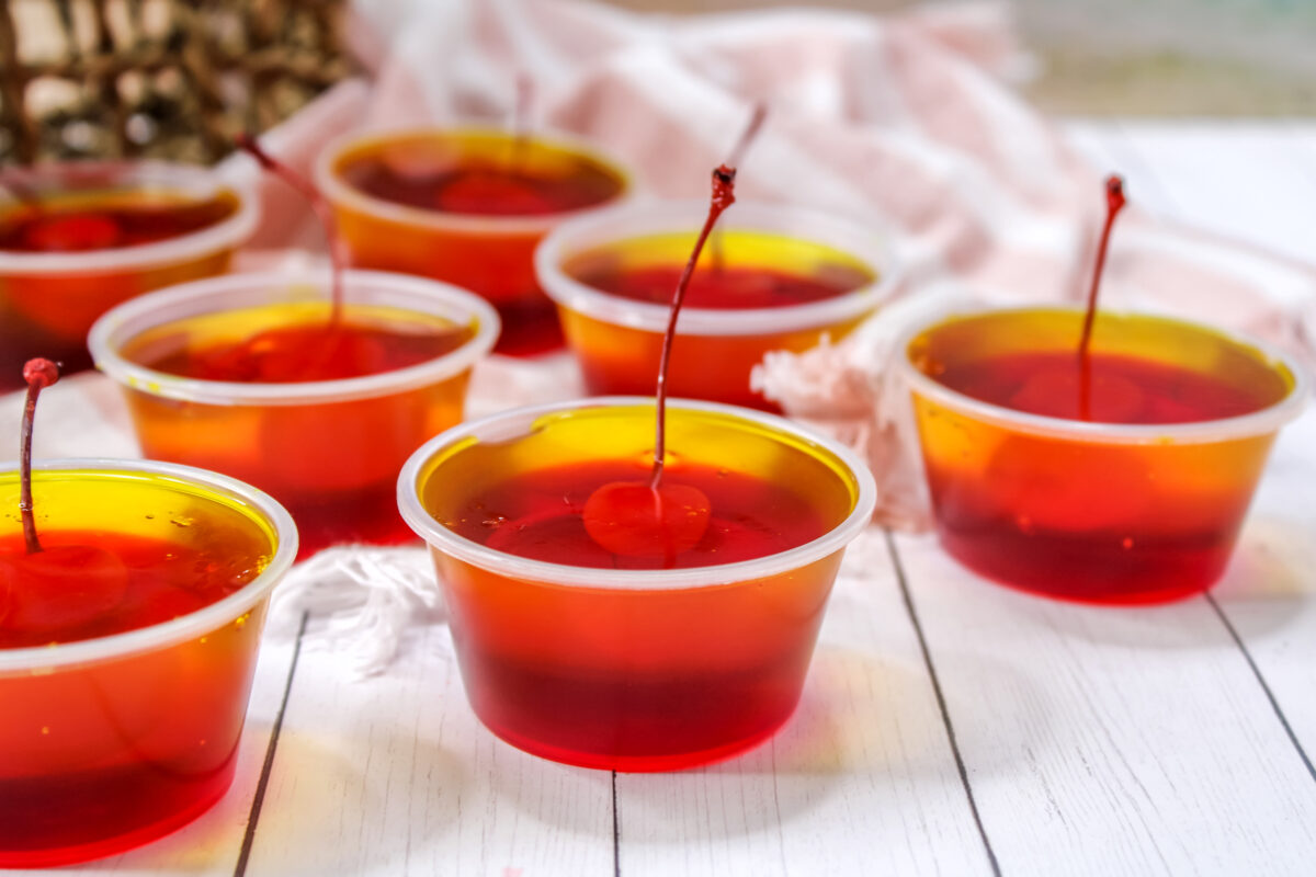 These pineapple upside down jello shots are a take on traditional pineapple upside down cakes. They're perfect for any party or get together!
