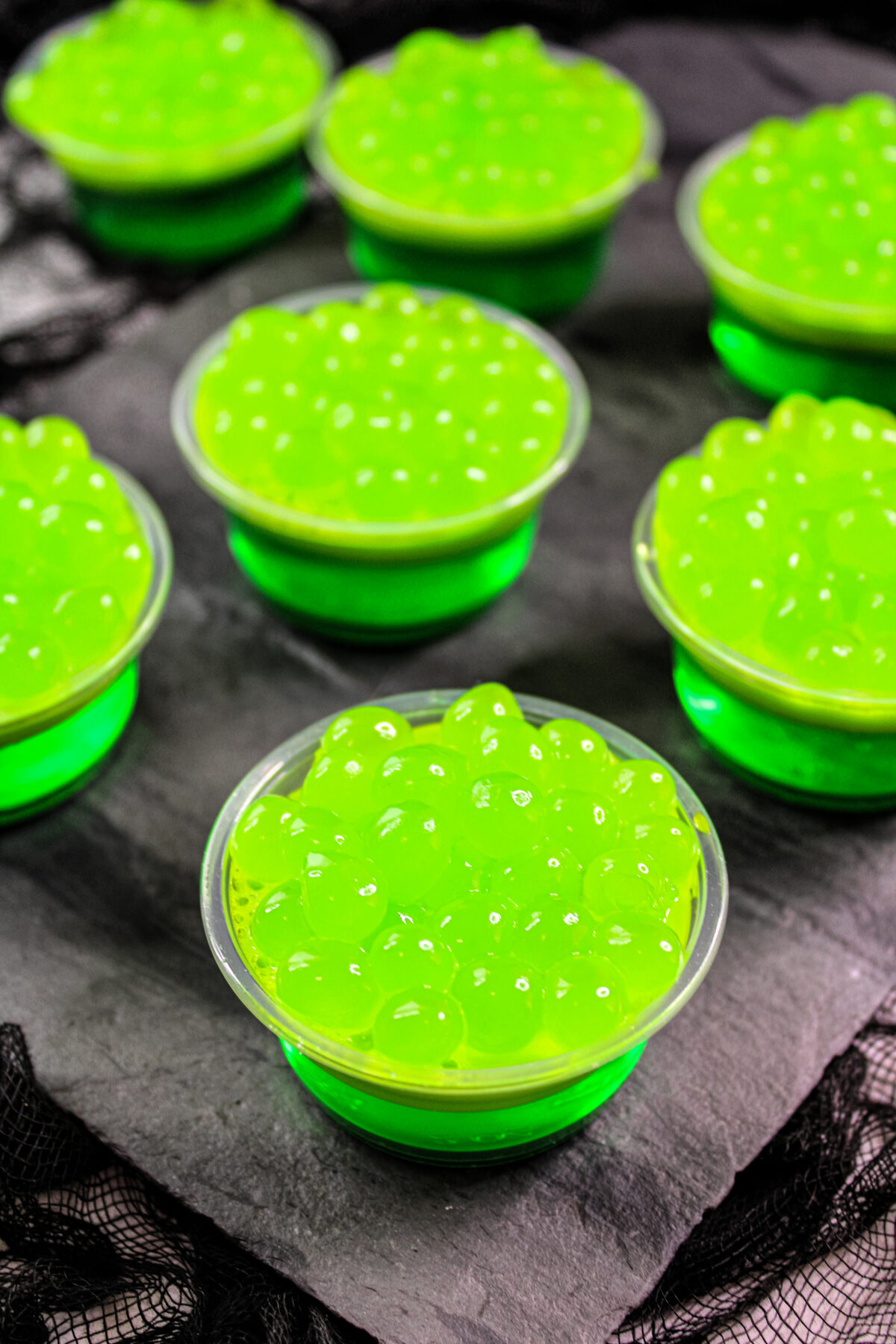 These spooky Witch's Brew Jello Shots are perfect for your Halloween party! Green apple flavoured and easy to make, they're sure to be a hit.