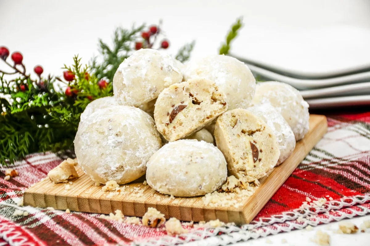 These chocolate kiss snowball cookies are a festive holiday treat. Easy to make, they're perfect for cookie exchanges and gift giving too.