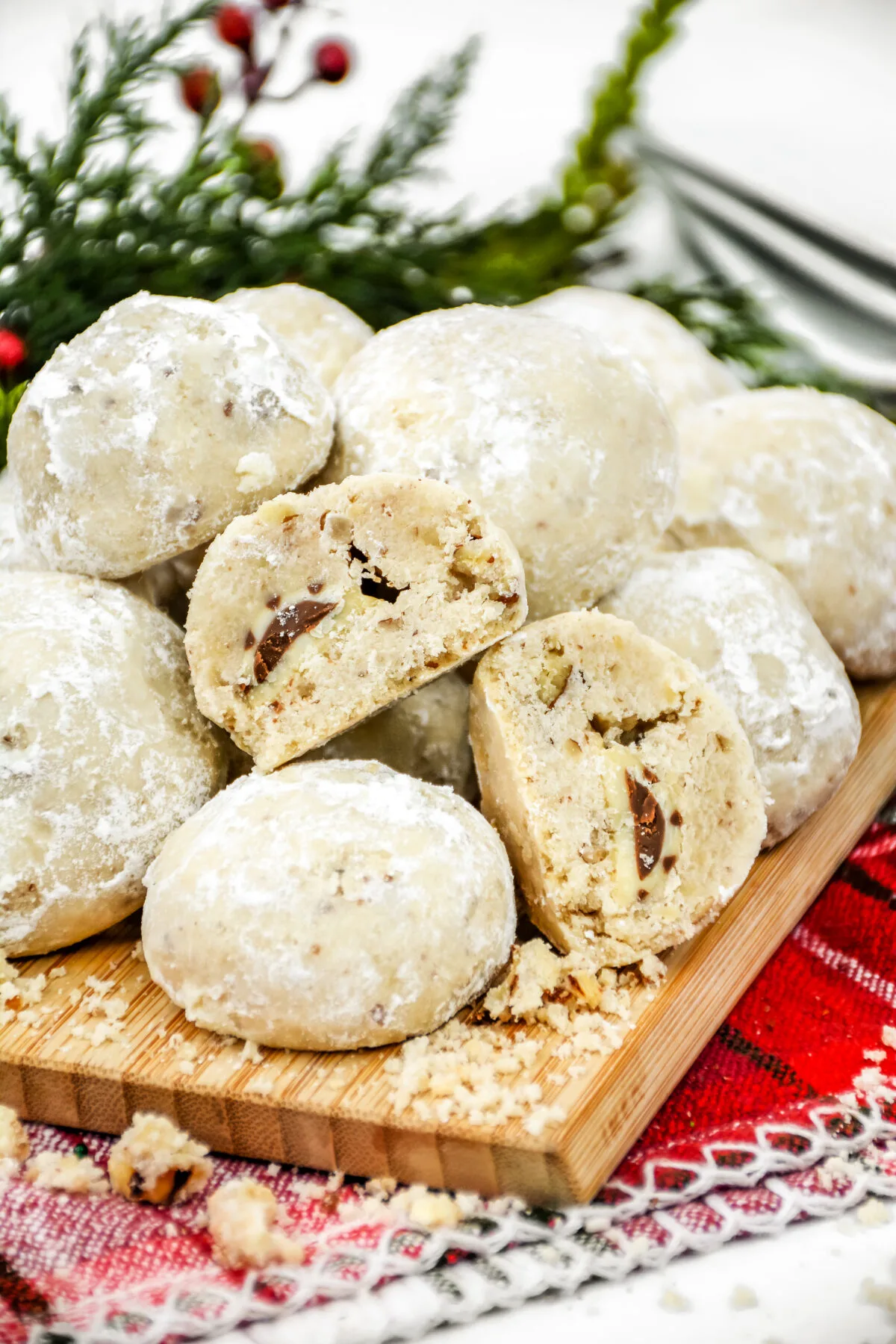 These chocolate kiss snowball cookies are a festive holiday treat. Easy to make, they're perfect for cookie exchanges and gift giving too.