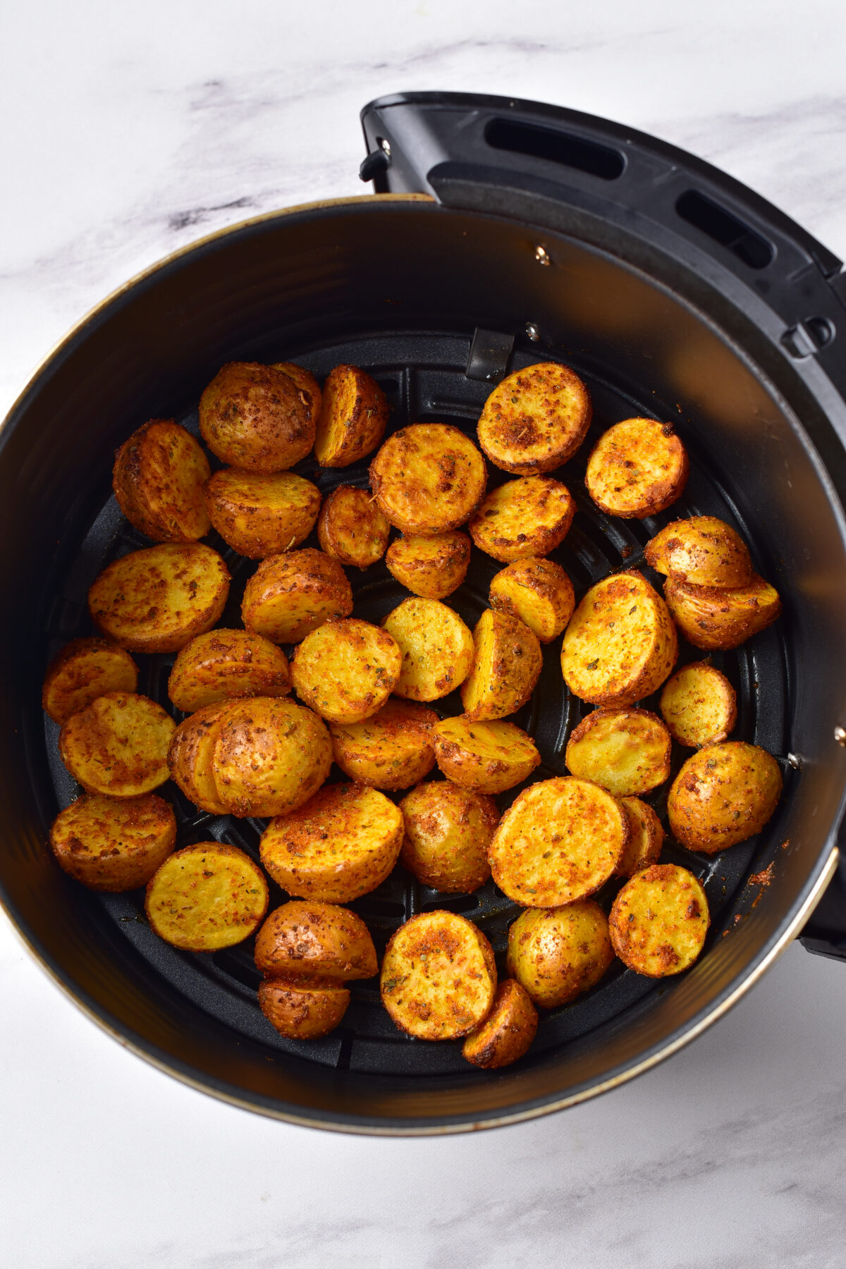 Baby potatoes half way through roasting.