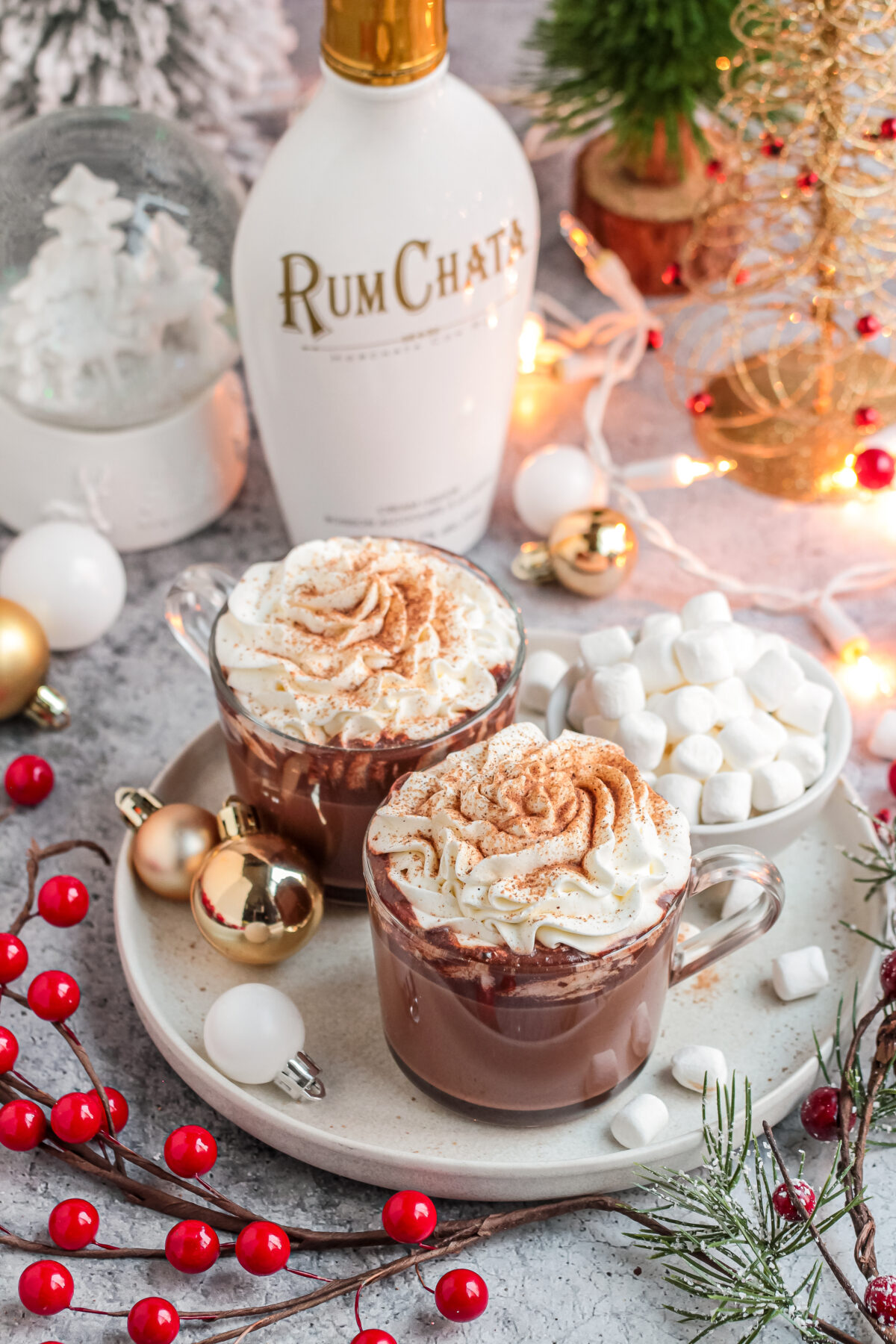 Try my easy recipe for the perfect holiday party drink. This RumChata hot cocoa is a fun twist on traditional hot chocolate!