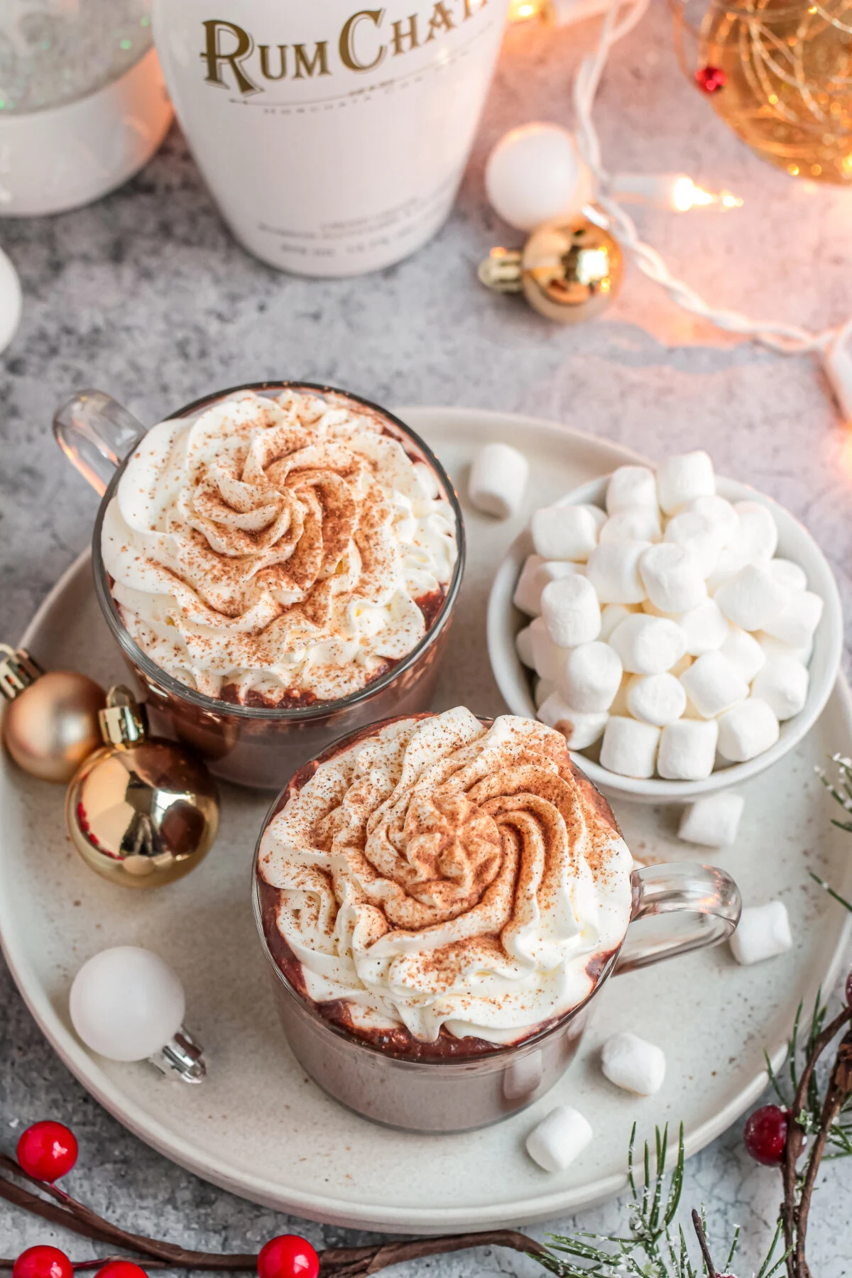 Try my easy recipe for the perfect holiday party drink. This RumChata hot cocoa is a fun twist on traditional hot chocolate!
