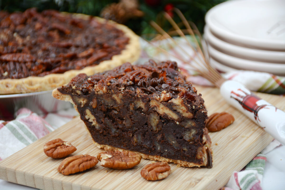 This easy chocolate pecan pie recipe is the perfect dessert for your next holiday gathering! It's rich and chocolatey with a fudgy texture.