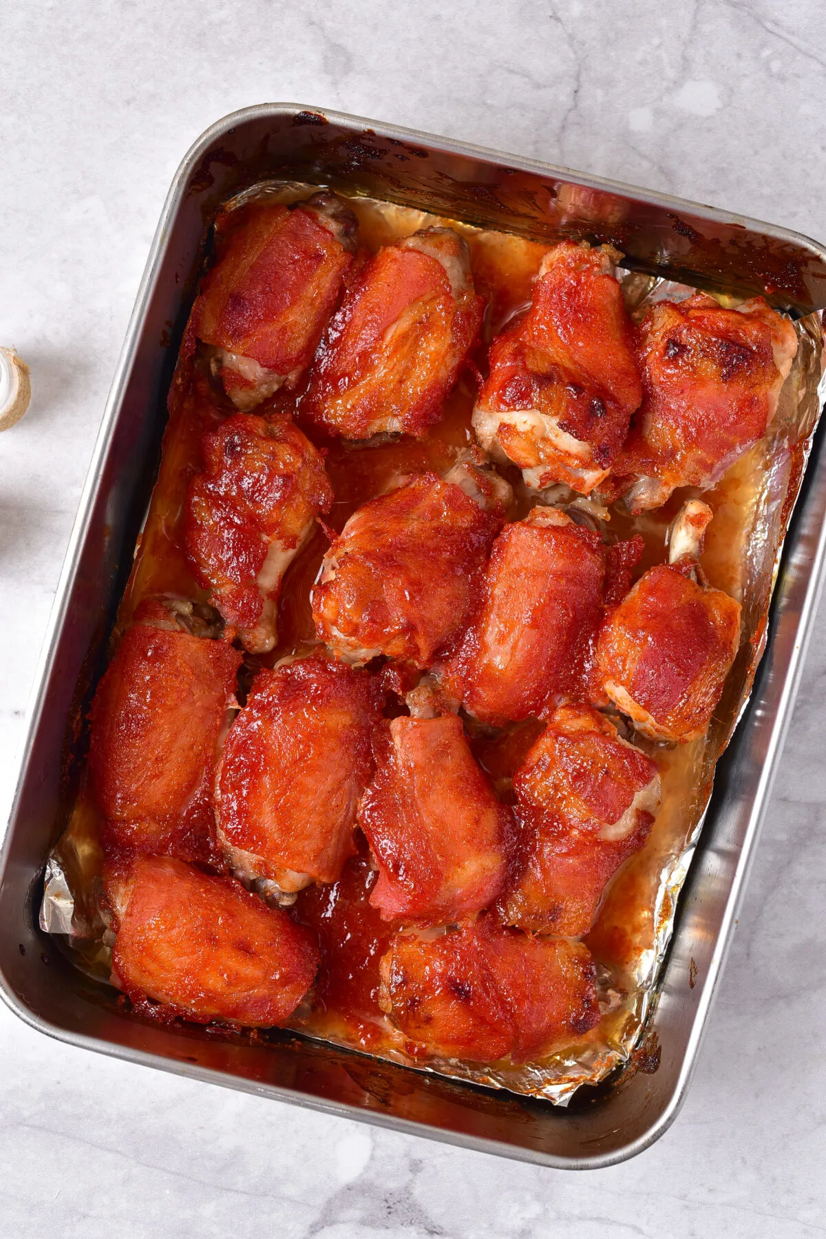 Maple-bacon chicken wings baked in the baking dish.